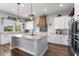 Bright and spacious kitchen featuring granite countertops, white cabinets, and modern stainless steel appliances at 3818 E Appaloosa Rd, Gilbert, AZ 85296