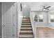 Carpeted staircase featuring a large landing and bright windows bringing in natural light at 3818 E Appaloosa Rd, Gilbert, AZ 85296