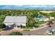 Aerial view of community clubhouse, pool and splashpad with ample shade and nearby parking at 3837 E Santa Fe Ln, Gilbert, AZ 85297