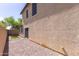 A low maintenance backyard with gravel and a small section of grass at 3837 E Santa Fe Ln, Gilbert, AZ 85297