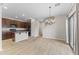 Open-concept kitchen and dining area with stainless steel appliances and tile flooring at 3837 E Santa Fe Ln, Gilbert, AZ 85297