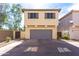 Attractive two-story home with a two-car garage, neutral tones and a well-kept landscape at 3837 E Santa Fe Ln, Gilbert, AZ 85297
