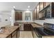 Well-equipped kitchen featuring stainless steel appliances and dark wood cabinets at 3837 E Santa Fe Ln, Gilbert, AZ 85297