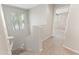 Bright staircase featuring neutral walls, carpeted steps, and a large window offering natural light at 3837 E Santa Fe Ln, Gilbert, AZ 85297