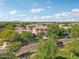 Aerial view of a two-story home in a neighborhood with mature trees and well-maintained lawns at 4109 E Sierra Madre Ave, Gilbert, AZ 85296