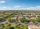 Picture of a neighborhood with mature trees. Many homes in the neighborhood have two stories at 4109 E Sierra Madre Ave, Gilbert, AZ 85296