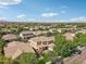 Aerial view of a two-story home in a community with mature trees and landscaping at 4109 E Sierra Madre Ave, Gilbert, AZ 85296