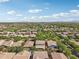 An expansive aerial view captures a vast residential area with mountain views and clear blue skies at 4109 E Sierra Madre Ave, Gilbert, AZ 85296