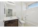 Bathroom with a tub-shower combo and a wooden vanity at 4109 E Sierra Madre Ave, Gilbert, AZ 85296