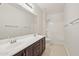 Bright bathroom with dual vanity, undermount sinks, and tile flooring at 4109 E Sierra Madre Ave, Gilbert, AZ 85296