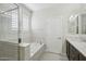 Bathroom features double vanity, marble countertops, soaking tub and walk-in shower at 4109 E Sierra Madre Ave, Gilbert, AZ 85296