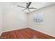 Bedroom featuring hardwood floors, a ceiling fan, and natural light at 4109 E Sierra Madre Ave, Gilbert, AZ 85296