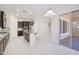 Bright, open kitchen featuring dark wood cabinetry, granite countertops, and stainless steel appliances at 4109 E Sierra Madre Ave, Gilbert, AZ 85296