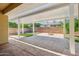 Spacious covered patio with brick and turf in backyard at 4109 E Sierra Madre Ave, Gilbert, AZ 85296