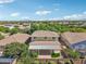 Aerial view of the rear of the home with a covered patio and well-manicured landscaping in a suburban neighborhood at 4109 E Sierra Madre Ave, Gilbert, AZ 85296