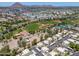 An aerial shot showing residential buildings next to well-maintained sports fields and courts, with a cityscape backdrop at 4228 N 81St St, Scottsdale, AZ 85251