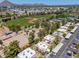 Aerial view highlighting residential apartments near sports fields, tennis courts, and scenic mountain views in the distance at 4228 N 81St St, Scottsdale, AZ 85251