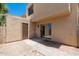 This back patio offers plenty of sunlight, a storage room, and a sliding glass door at 4228 N 81St St, Scottsdale, AZ 85251