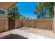 A small back patio enclosed by a cinderblock wall and offering shade from tall trees at 4228 N 81St St, Scottsdale, AZ 85251