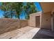 This home's cozy back patio offers shade and privacy, with a small storage shed at 4228 N 81St St, Scottsdale, AZ 85251