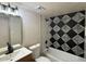 Stylish bathroom featuring modern fixtures, unique tile accent wall, and a sleek vanity at 4228 N 81St St, Scottsdale, AZ 85251