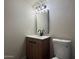 Cozy bathroom vanity with modern fixtures and matching mirror and neutral walls at 4228 N 81St St, Scottsdale, AZ 85251