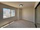 Bright bedroom with large window and neutral carpet, offering a serene and comfortable space at 4228 N 81St St, Scottsdale, AZ 85251