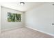 Bright bedroom featuring a large window and neutral carpet at 4228 N 81St St, Scottsdale, AZ 85251