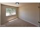 Bright bedroom with carpet, a view of the landscaping, and neutral walls at 4228 N 81St St, Scottsdale, AZ 85251