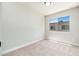 Bright bedroom with neutral carpet and a window offering neighborhood views at 4228 N 81St St, Scottsdale, AZ 85251