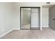 Bedroom featuring a mirrored closet and neutral carpet at 4228 N 81St St, Scottsdale, AZ 85251