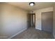 Bedroom with neutral walls, carpeted floor, closet and attached bathroom at 4228 N 81St St, Scottsdale, AZ 85251