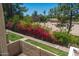 This charming courtyard features colorful flowering bushes, mature trees, and park access at 4228 N 81St St, Scottsdale, AZ 85251