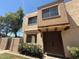 Inviting two-story exterior showcasing a well-maintained stucco facade, tasteful landscaping, and dual front doors at 4228 N 81St St, Scottsdale, AZ 85251