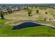 Overhead picture of a manicured golf course and pond with mature landscaping and views of the community at 4228 N 81St St, Scottsdale, AZ 85251