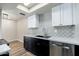 Modern kitchen featuring stainless steel dishwasher, ample cabinets, and stylish backsplash at 4228 N 81St St, Scottsdale, AZ 85251
