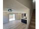 Spacious living room with sliding glass door, hardwood floors, and modern kitchen at 4228 N 81St St, Scottsdale, AZ 85251