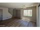 Open living room with hardwood floors, staircase, double doors, and natural light at 4228 N 81St St, Scottsdale, AZ 85251