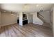 Spacious living room features hardwood floors, modern lighting, and open kitchen at 4228 N 81St St, Scottsdale, AZ 85251