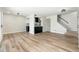 Open-concept living space featuring modern flooring and a kitchen in the background at 4228 N 81St St, Scottsdale, AZ 85251