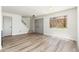 Bright living room featuring wood-look floors and a window with natural light at 4228 N 81St St, Scottsdale, AZ 85251