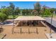 Bird's eye view of a modern playground, featuring swings, slides, and climbing structures, with shaded picnic areas at 4228 N 81St St, Scottsdale, AZ 85251