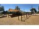 Outdoor playground with swings and climbing features under a large shade canopy at 4228 N 81St St, Scottsdale, AZ 85251