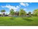 The large backyard features mature trees, offering privacy and shade at 502 W Port Royale Ln, Phoenix, AZ 85023