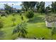 Expansive backyard with lush green grass and mature trees at 502 W Port Royale Ln, Phoenix, AZ 85023