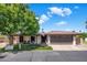 Charming single-story home with a well-manicured front yard and a two-car garage at 502 W Port Royale Ln, Phoenix, AZ 85023