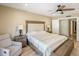 Comfortable main bedroom featuring neutral color scheme, ceiling fan, and plank flooring at 502 W Port Royale Ln, Phoenix, AZ 85023