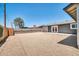 Spacious backyard with gravel landscape, offering potential for customized outdoor activities and relaxation under the sun at 5236 S 19Th Ave, Phoenix, AZ 85041