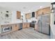 Bright, modern kitchen features stainless steel appliances, light wood cabinets, and subway tile backsplash at 5236 S 19Th Ave, Phoenix, AZ 85041
