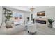 Bright living room features a modern fireplace and French doors leading to the backyard at 5236 S 19Th Ave, Phoenix, AZ 85041